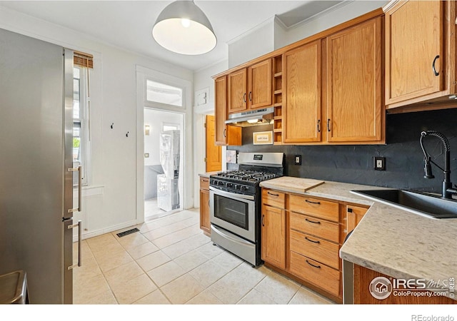 2955 Columbine St, Denver, CO 80205 - kitchen featuring appliances with stainless steel finishes, under cabinet range hood, open shelves, backsplash, and light countertops
