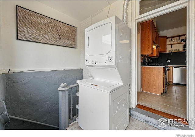 2955 Columbine St, Denver, CO 80205 - laundry area featuring stacked washer / drying machine and light tile patterned floors