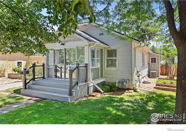 834 Emery St, Longmont, CO 80501 - view of front of house with a sunroom