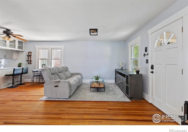 834 Emery St, Longmont, CO 80501 - living area featuring wood finished floors and ceiling fan