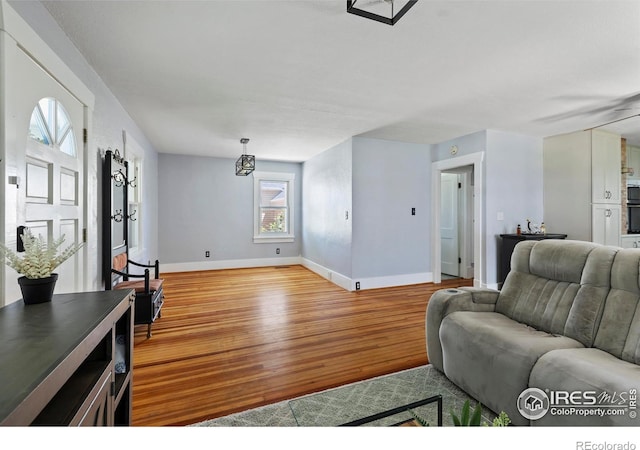 834 Emery St, Longmont, CO 80501 - living area with wood finished floors and baseboards