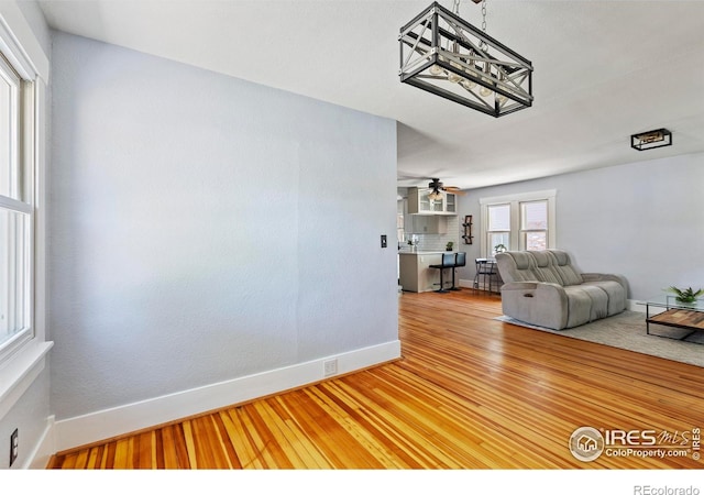 834 Emery St, Longmont, CO 80501 - living room featuring light wood finished floors and a ceiling fan