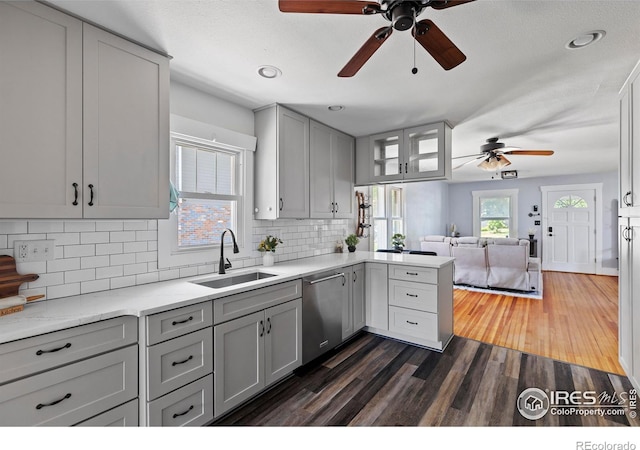 834 Emery St, Longmont, CO 80501 - kitchen with a ceiling fan, dishwasher, open floor plan, gray cabinetry, and a peninsula