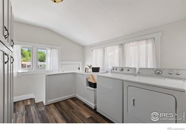 834 Emery St, Longmont, CO 80501 - laundry room featuring washing machine and clothes dryer, dark wood-type flooring, and cabinet space