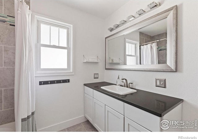 834 Emery St, Longmont, CO 80501 - bathroom featuring plenty of natural light, vanity, and shower / bath combination with curtain