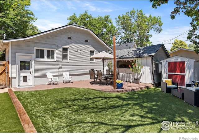 834 Emery St, Longmont, CO 80501 - back of property featuring a shed and a patio area