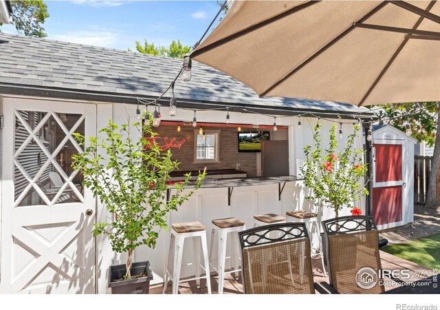 834 Emery St, Longmont, CO 80501 - view of patio / terrace with a shed