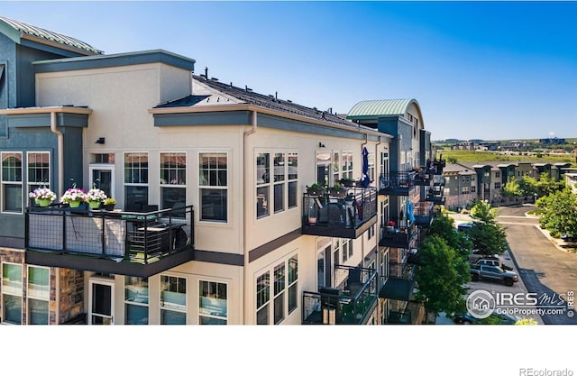 13598 Via Varra Unit 412, Broomfield, CO 80020 - view of home's exterior featuring stucco siding and a balcony