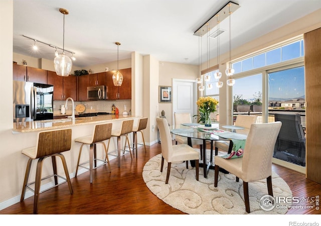 13598 Via Varra Unit 412, Broomfield, CO 80020 - dining room with dark wood-style floors