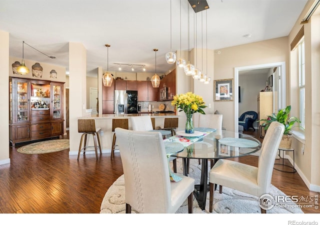 13598 Via Varra Unit 412, Broomfield, CO 80020 - dining space featuring dark wood finished floors and baseboards