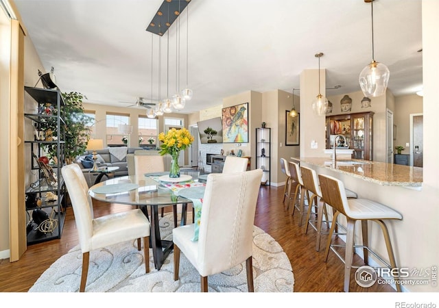 13598 Via Varra Unit 412, Broomfield, CO 80020 - dining area featuring wood finished floors and a ceiling fan