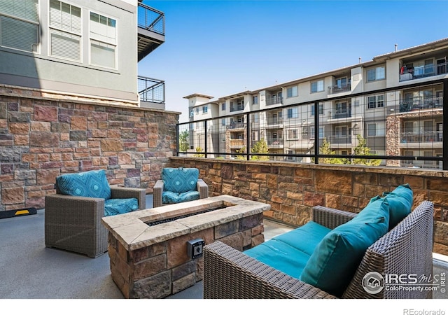 13598 Via Varra Unit 412, Broomfield, CO 80020 - view of patio / terrace featuring a fire pit