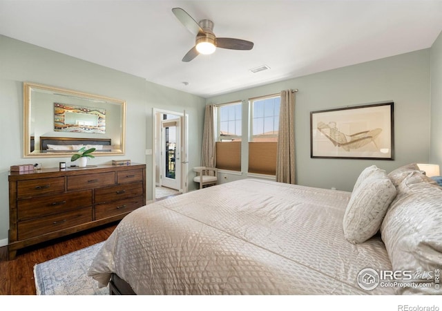 13598 Via Varra Unit 412, Broomfield, CO 80020 - bedroom with dark wood-style floors and ceiling fan