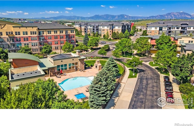 13598 Via Varra Unit 412, Broomfield, CO 80020 - drone / aerial view of a pool and a mountainous background