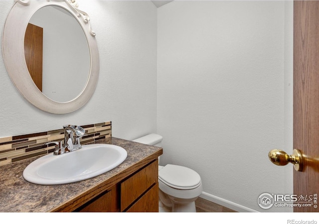 3233 Baldwin Ave, Evans, CO 80620 - bathroom with decorative backsplash and vanity