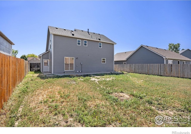 3233 Baldwin Ave, Evans, CO 80620 - back of property with a fenced backyard