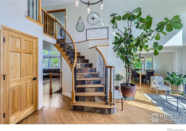 6366 Umber Cir, Arvada, CO 80403 - stairs with wood finished floors and a high ceiling