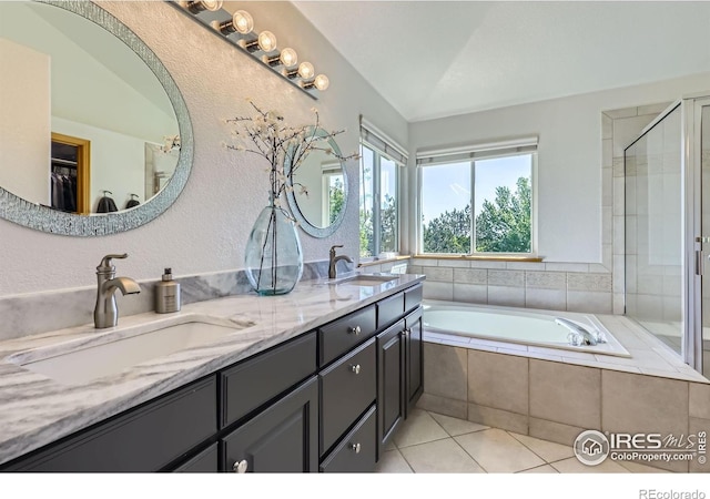 6366 Umber Cir, Arvada, CO 80403 - bathroom featuring double vanity, tile patterned flooring, a garden tub, and a tile shower