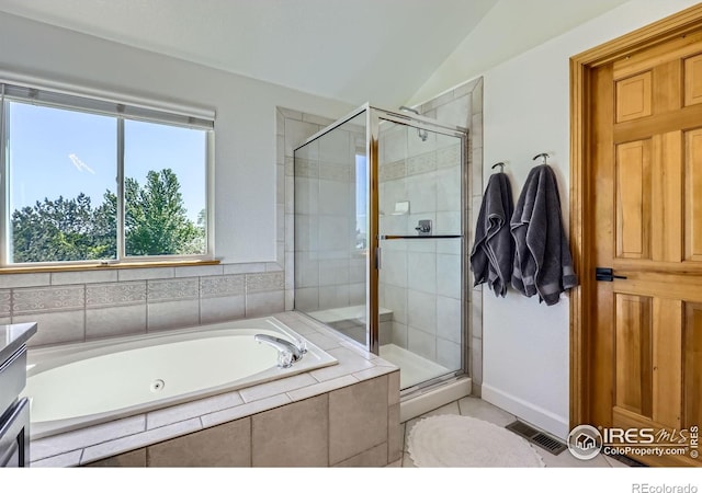 6366 Umber Cir, Arvada, CO 80403 - bathroom featuring a garden tub, a shower stall, lofted ceiling, and tile patterned flooring
