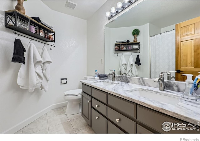 6366 Umber Cir, Arvada, CO 80403 - bathroom with double vanity and tile patterned flooring