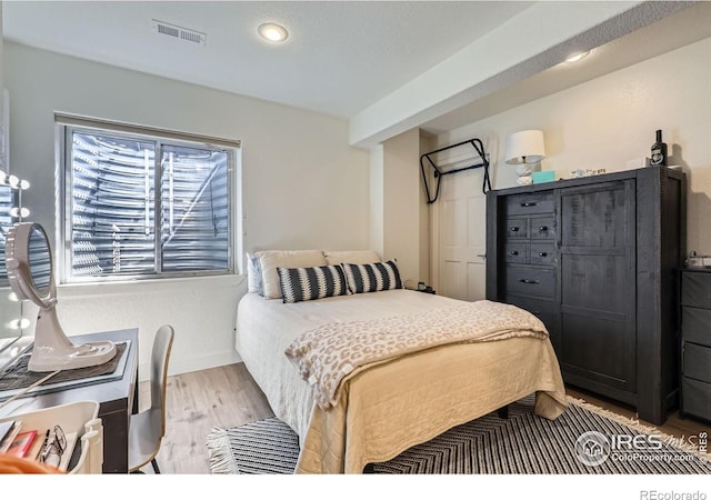 6366 Umber Cir, Arvada, CO 80403 - bedroom with light wood finished floors and recessed lighting