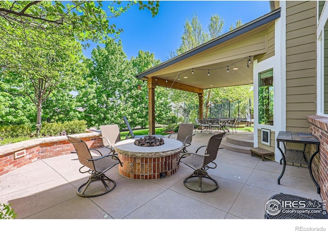 6366 Umber Cir, Arvada, CO 80403 - view of patio with an outdoor fire pit and outdoor dining space