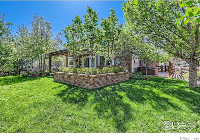 6366 Umber Cir, Arvada, CO 80403 - back of property with a hot tub and a patio