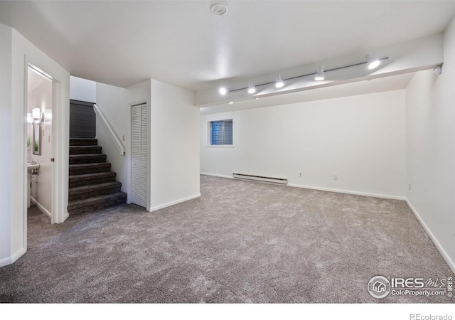 1220 Solstice Ln, Fort Collins, CO 80525 - finished below grade area with a baseboard radiator, carpet floors, and stairway