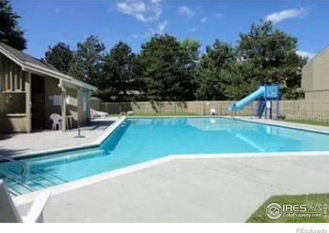 1220 Solstice Ln, Fort Collins, CO 80525 - community pool featuring a patio and a water slide