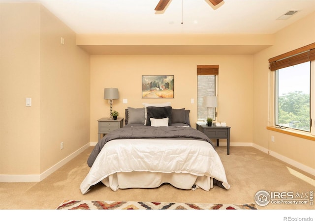 5060 Pierre St Unit E, Boulder, CO 80304 - bedroom with light carpet and a ceiling fan