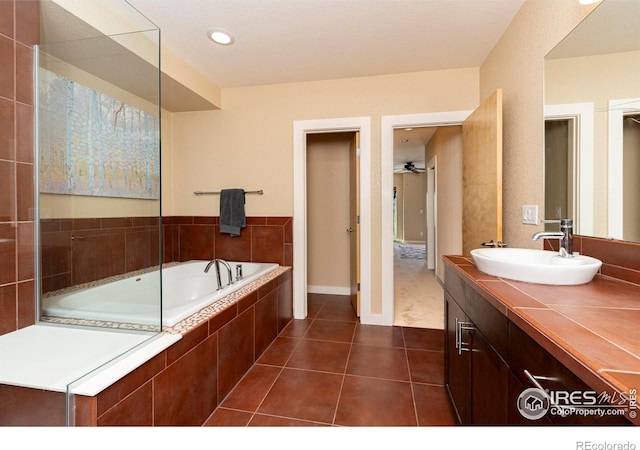 5060 Pierre St Unit E, Boulder, CO 80304 - full bath with tiled bath, vanity, and tile patterned floors