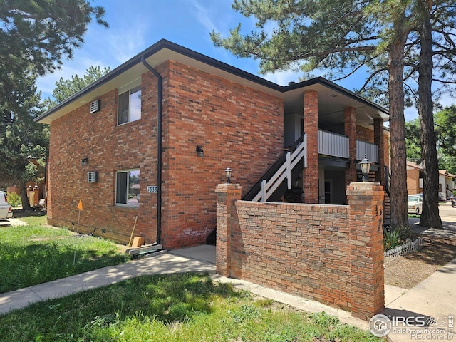 1339 Vivian St, Longmont, CO 80501 - view of home's exterior with brick siding