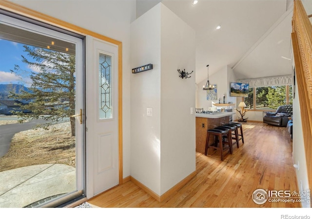 1437 Raven Cir Unit A, Estes Park, CO 80517 - entryway featuring light wood finished floors and vaulted ceiling