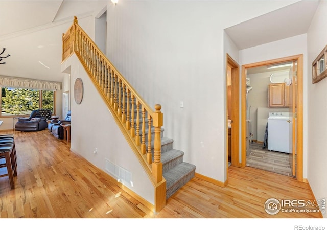 1437 Raven Cir Unit A, Estes Park, CO 80517 - stairs with washer / dryer and wood finished floors