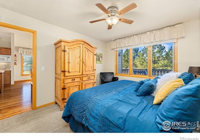 1437 Raven Cir Unit A, Estes Park, CO 80517 - bedroom featuring light colored carpet and a ceiling fan
