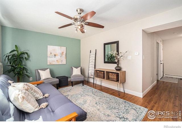 705 E Drake Rd Unit 45, Fort Collins, CO 80525 - living room with wood finished floors, a ceiling fan, and a baseboard radiator