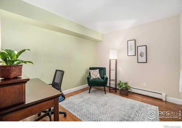 705 E Drake Rd Unit 45, Fort Collins, CO 80525 - office area featuring wood finished floors and a baseboard heating unit
