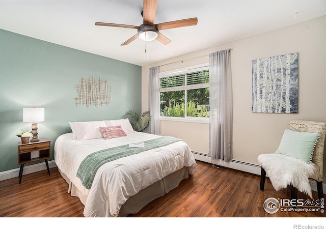 705 E Drake Rd Unit 45, Fort Collins, CO 80525 - bedroom featuring baseboard heating, wood finished floors, and ceiling fan