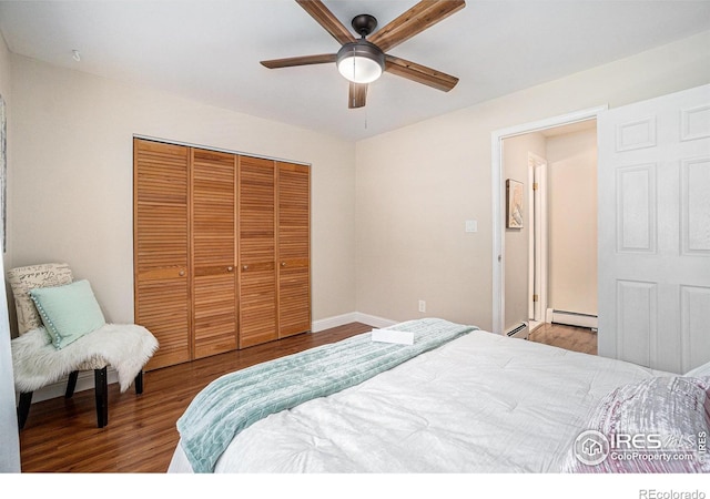 705 E Drake Rd Unit 45, Fort Collins, CO 80525 - bedroom with baseboard heating, a closet, wood finished floors, and a ceiling fan