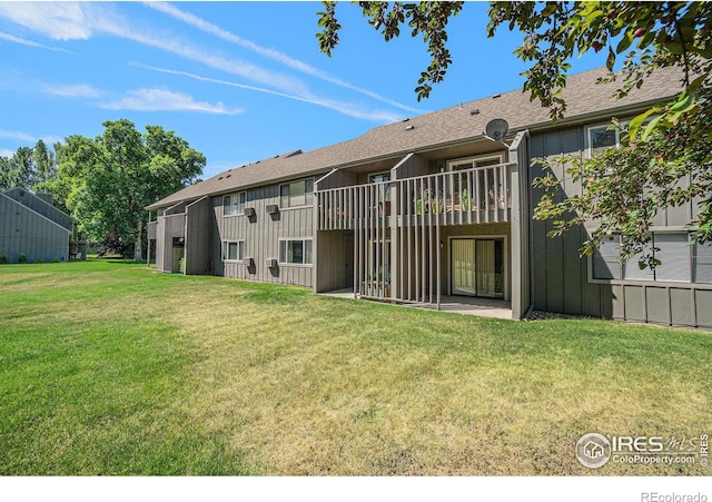 705 E Drake Rd Unit 45, Fort Collins, CO 80525 - rear view of property with a lawn