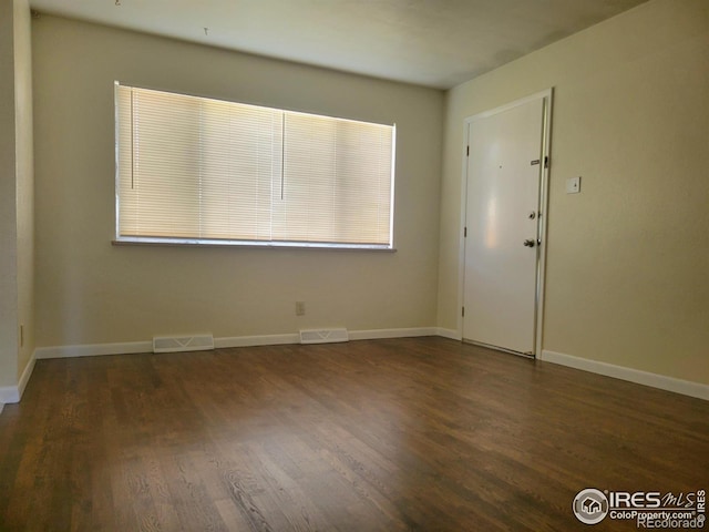 117 Valentine Ln, Longmont, CO 80501 - empty room featuring wood finished floors and baseboards
