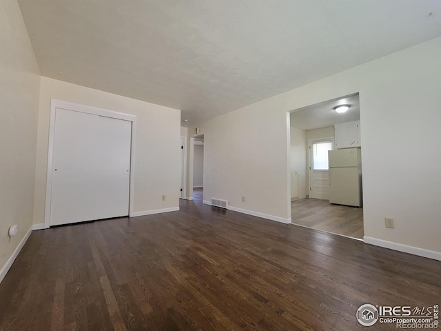 117 Valentine Ln, Longmont, CO 80501 - spare room with dark wood-type flooring and baseboards