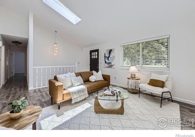 1287 Doric Dr, Lafayette, CO 80026 - living area with wood finished floors, a skylight, and high vaulted ceiling