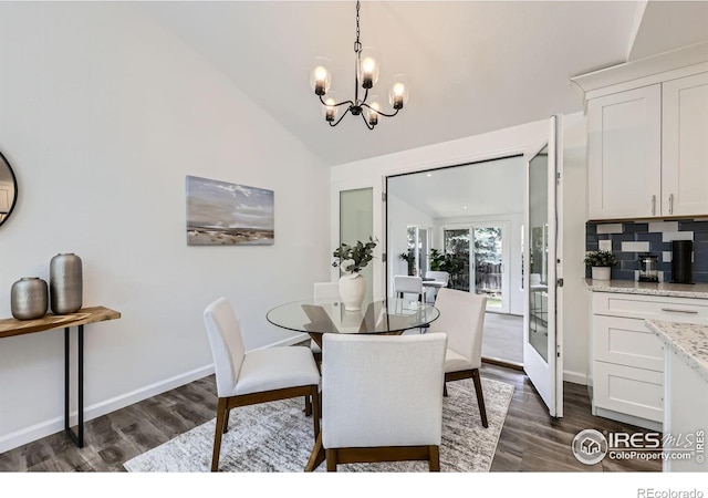 1287 Doric Dr, Lafayette, CO 80026 - dining room featuring dark wood-style flooring, lofted ceiling, and a chandelier