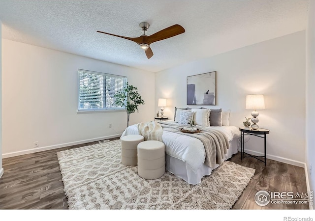 1287 Doric Dr, Lafayette, CO 80026 - bedroom featuring a textured ceiling, wood finished floors, and ceiling fan