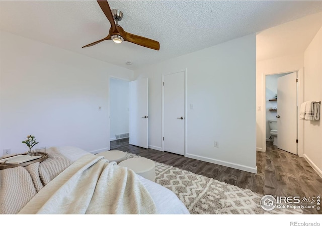 1287 Doric Dr, Lafayette, CO 80026 - bedroom featuring wood finished floors, a ceiling fan, and a textured ceiling