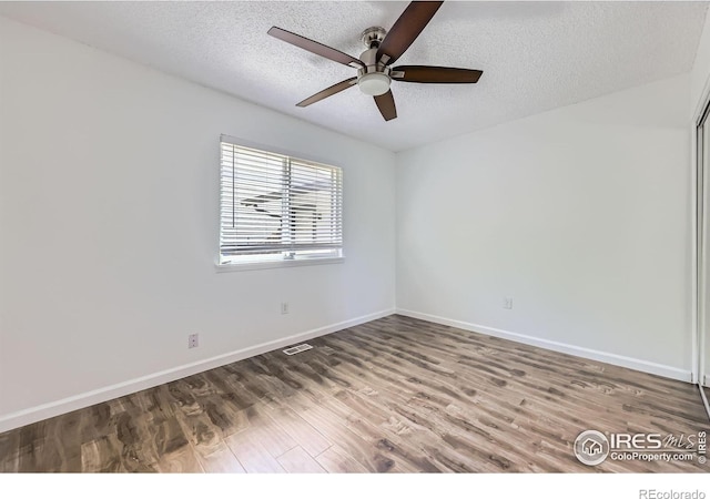 1287 Doric Dr, Lafayette, CO 80026 - spare room with a ceiling fan, a textured ceiling, and wood finished floors