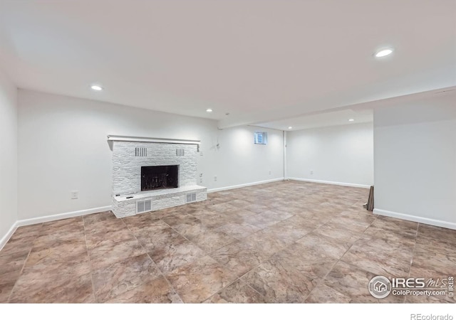 1287 Doric Dr, Lafayette, CO 80026 - unfurnished living room with recessed lighting and a fireplace with raised hearth