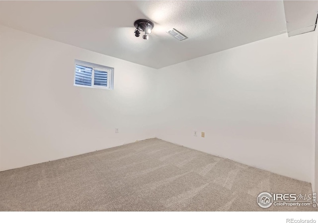1287 Doric Dr, Lafayette, CO 80026 - unfurnished room featuring carpet floors and a textured ceiling