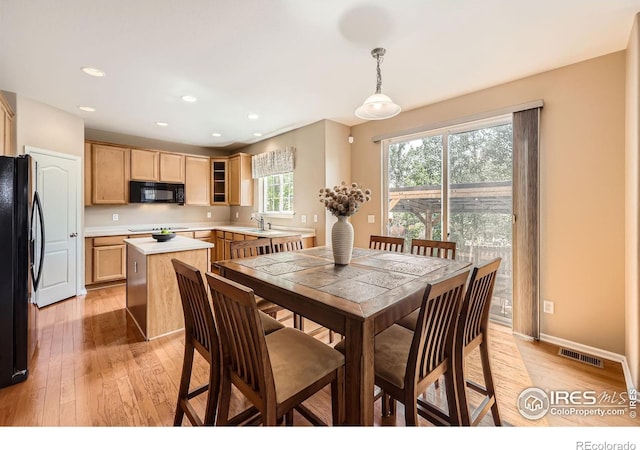 13065 Tamarac Pl, Thornton, CO 80602 - dining space with light wood-style floors and recessed lighting